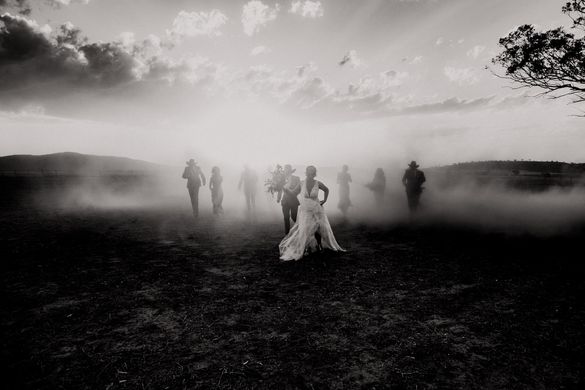 Bridal party wedding running out of dust storm